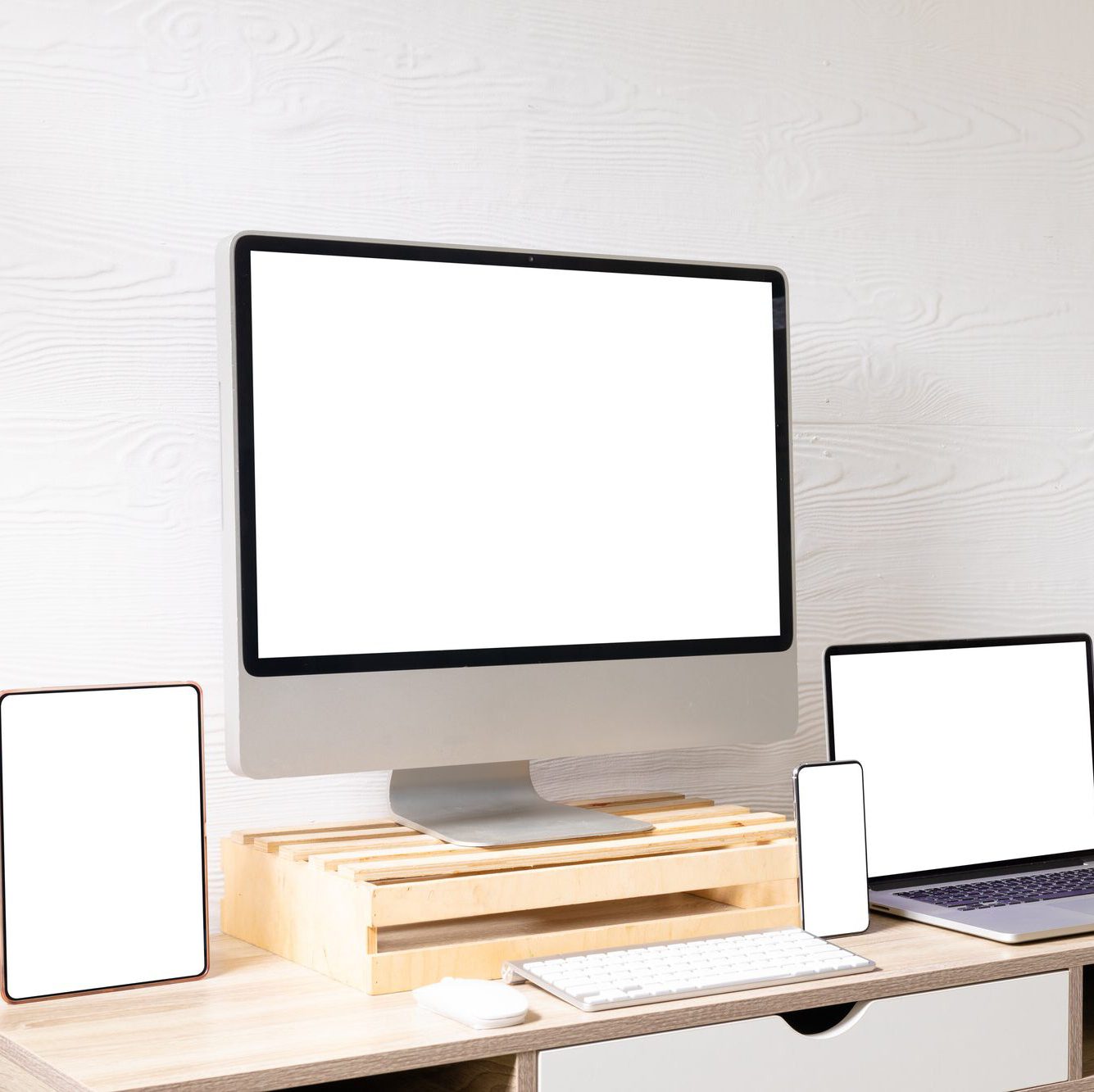 Composition of desktop computer, laptop, tablet and smartphone with copy space on white background